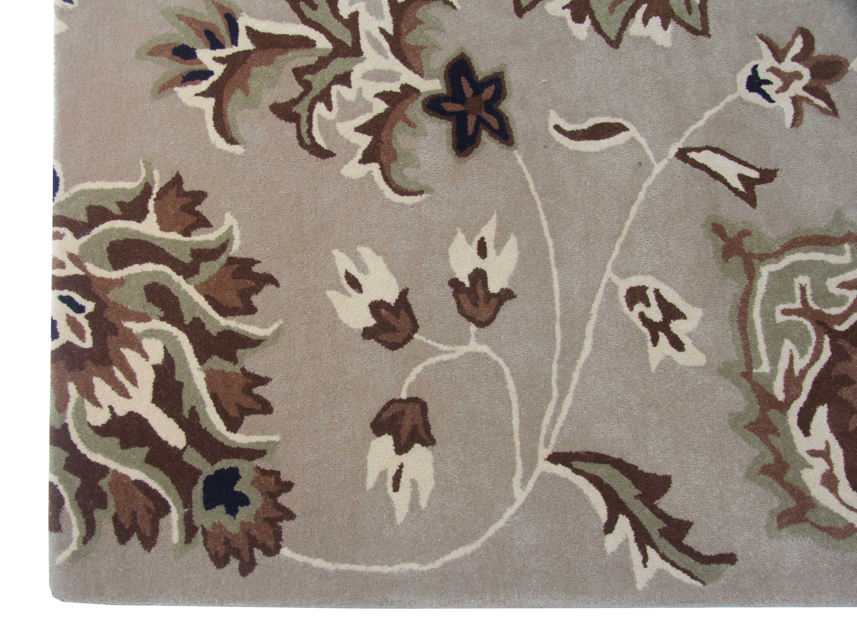 Close-up of the RAMSHA HOME Exquisite Multi Color Handmade Rug - HTW 09 (200x300 cm), featuring an ornate beige base with intricate floral designs in brown, green, cream, and dark blue for a timeless look.