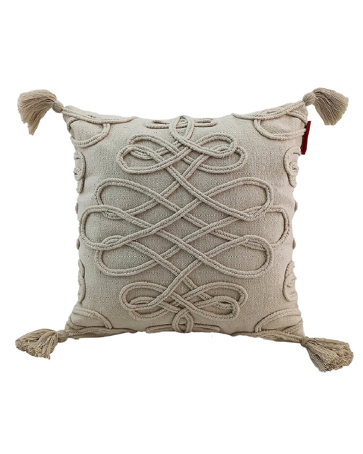 RAMSHA HOME's Embroidery Cushion With Tassel CS-159 is a square beige cotton cushion with intricate raised woven patterns, tassels on each corner, and a stylish decorative design featuring a red tag on the upper right side.