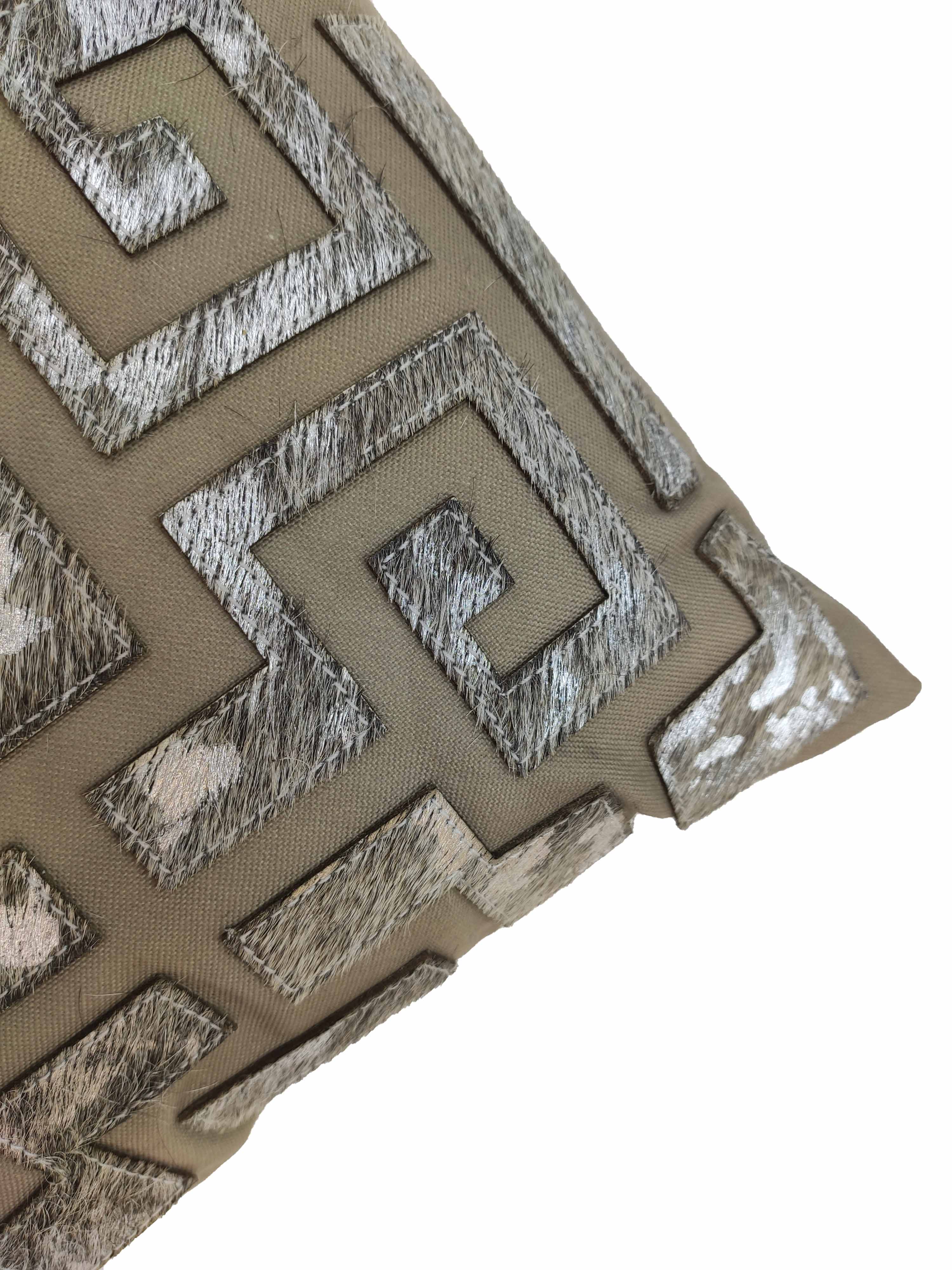 The RAMSHA HOME Sofa & Chair Cushion CS-106 showcases a modern geometric Greek key pattern in metallic silver and beige with textured, shiny fabric accents.