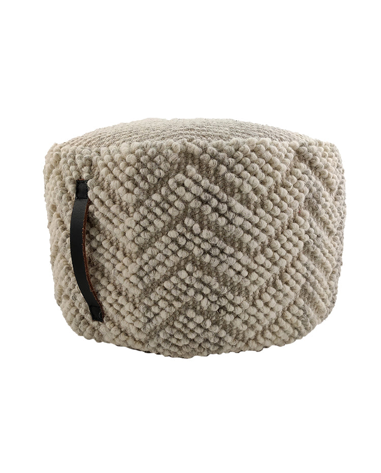 The RAMSHA HOME Natural Wool Pouf With Leather Handle PF-045 features a beige, textured wool finish with a chevron pattern and a black leather handle on the side.