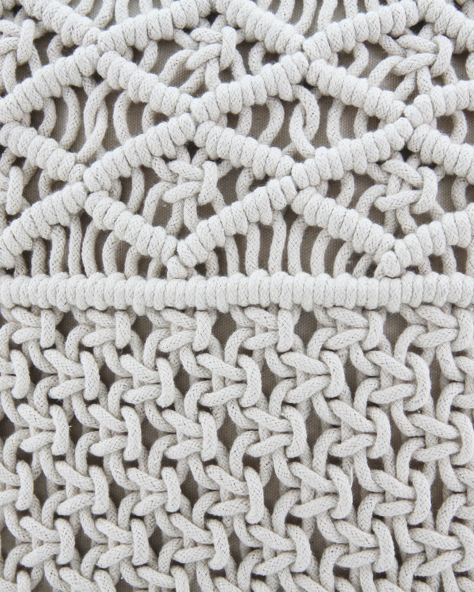 Close-up of the RAMSHA HOME Woven Macrame Cotton Cushion cs-166-170, showcasing thick off-white cord in diamond and interlocking knot patterns, crafted with soft polyester fiber fill on a neutral fabric background.