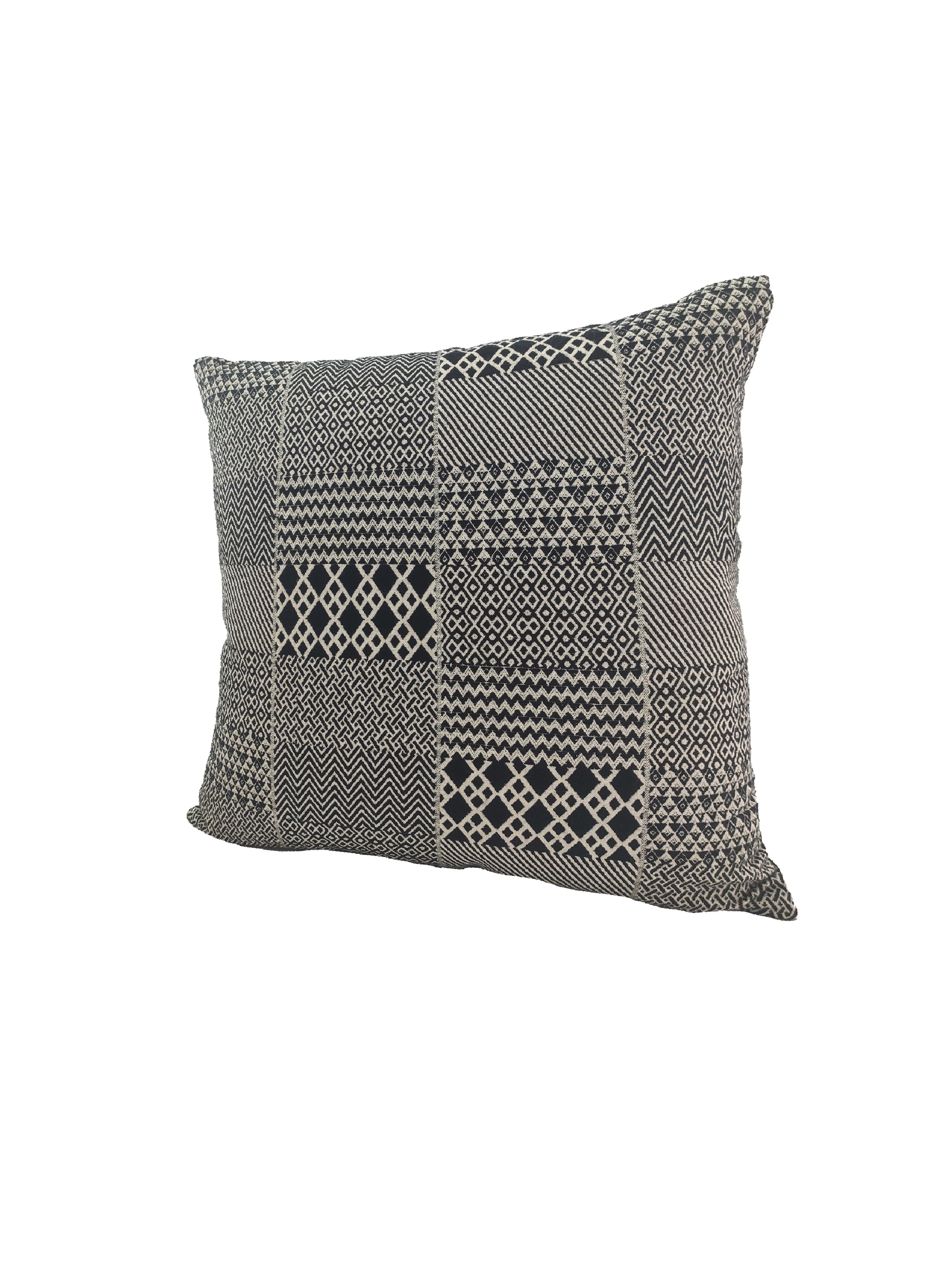 The RAMSHA HOME Black & White Cotton Cushion Cover CS-130 features a geometric patchwork of zigzag, diamond, and chevron patterns on white cotton, adding modern flair to any space.