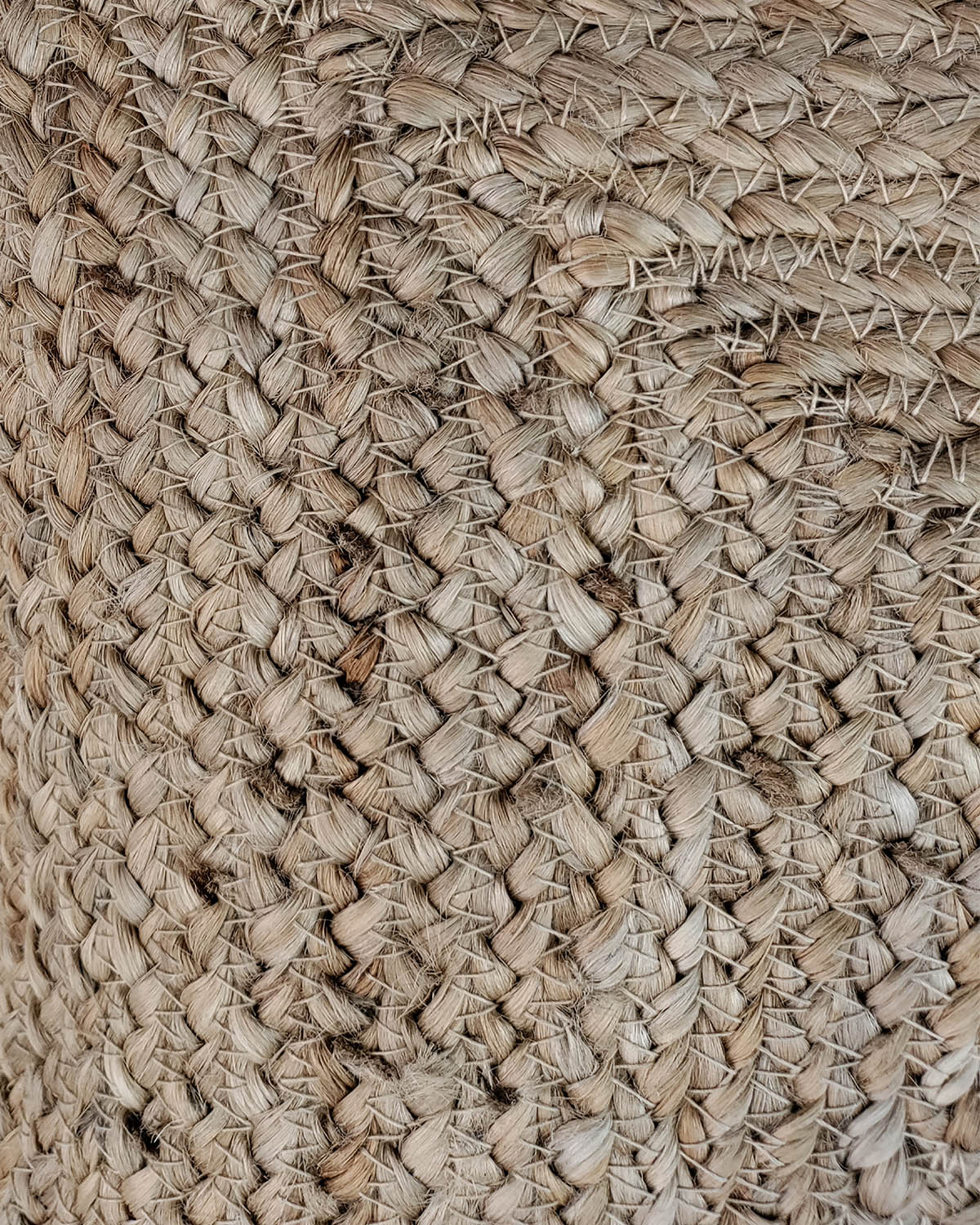 Close-up of a woven natural fiber basket with interlaced beige and light brown strands—perfect rustic décor when paired with the RAMSHA HOME Jute Cushion With Small Fringes cs-145.