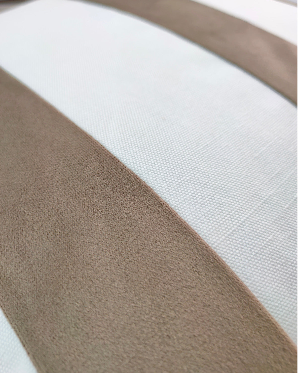 Close-up of RAMSHA HOME’s White & Brown Cushion CS-138 showcasing durable fabric with wide beige suede-like stripes and white textured stripes—an elegant and smooth pattern ideal for stylish home décor.