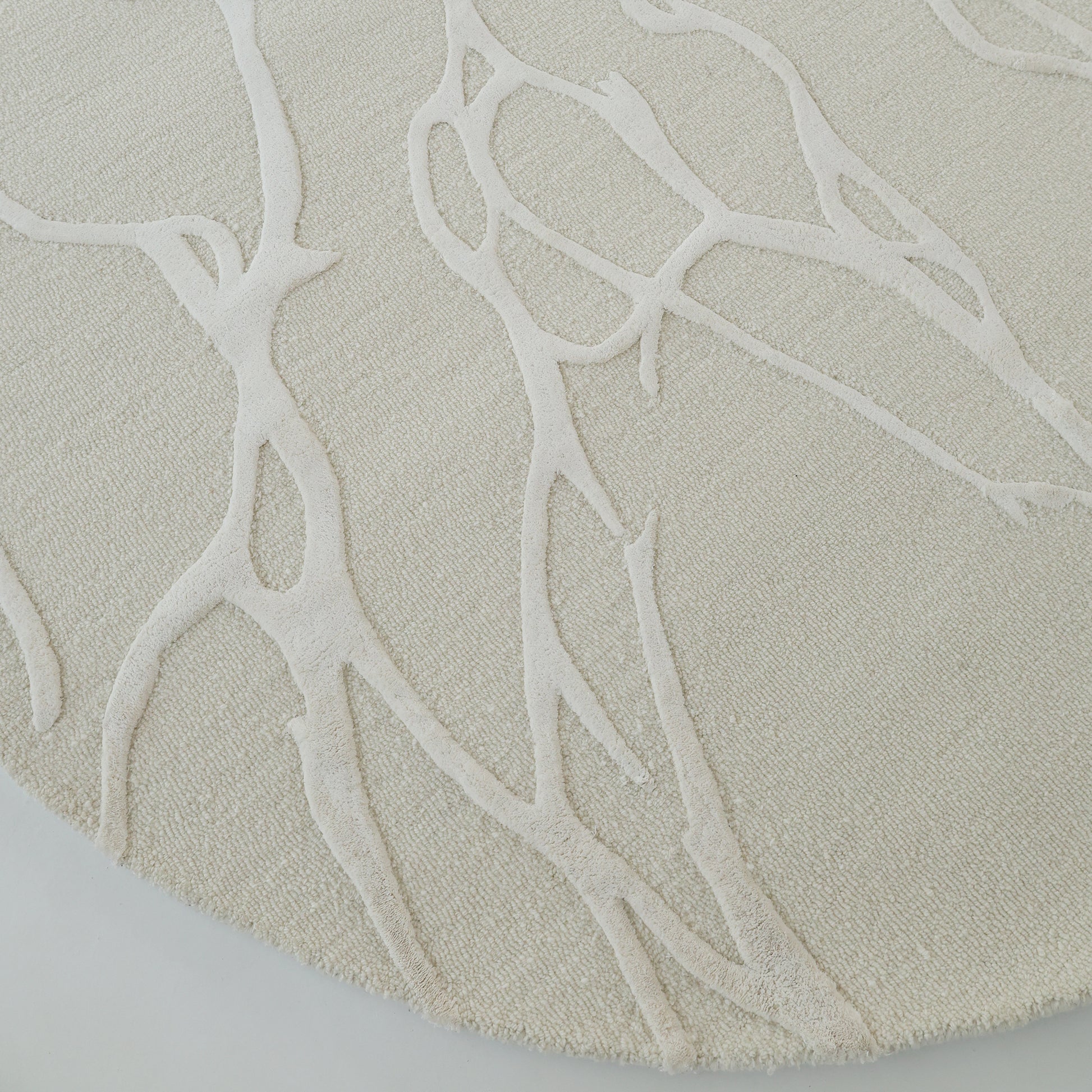 A close-up of the RAMSHA HOME Premium Beige Handmade Carpet HTWV-100 (200×300 cm), showcasing its light beige tone and subtle, raised abstract branch-like pattern for elegant texture.