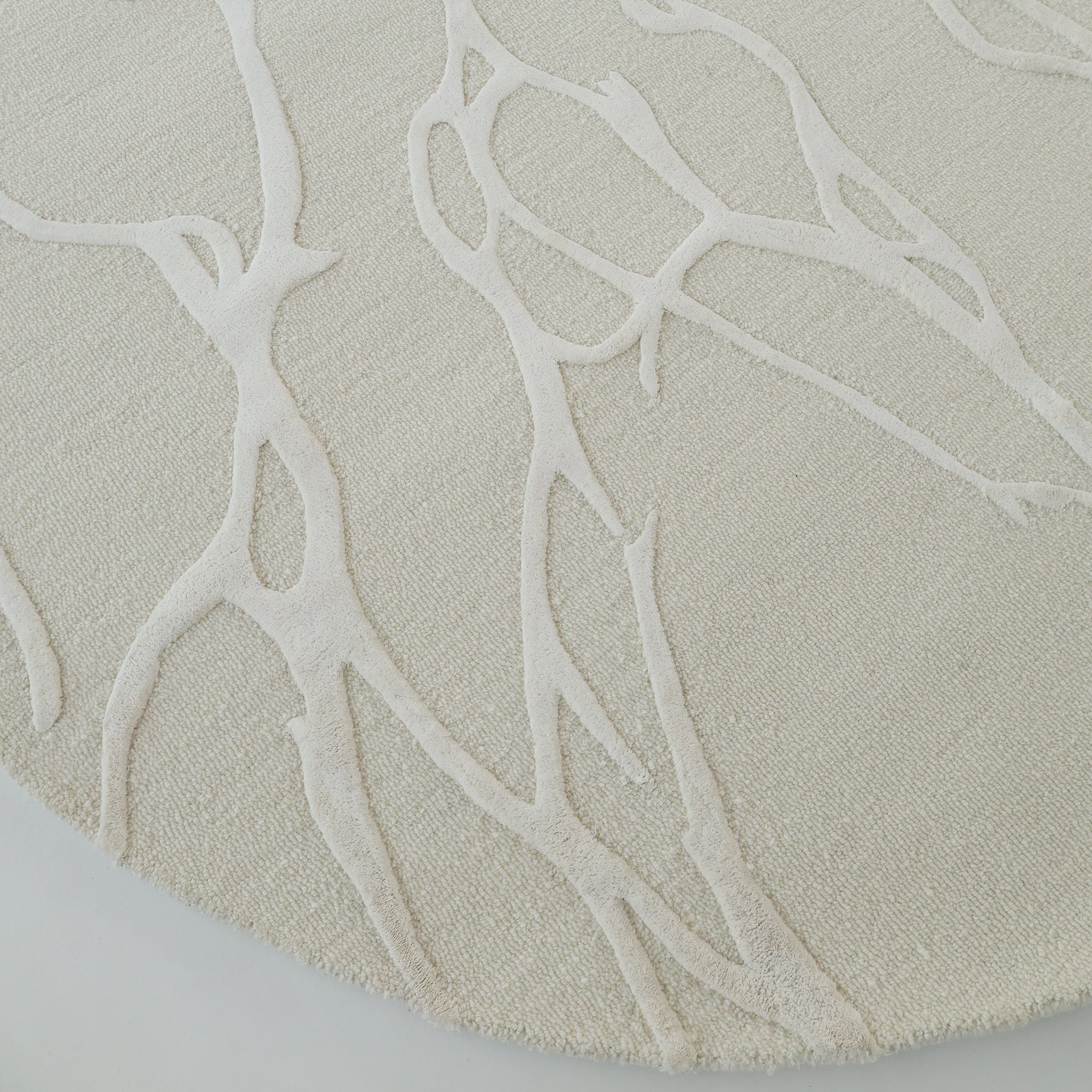 A close-up of the RAMSHA HOME Premium Beige Handmade Carpet HTWV-100 (200×300 cm), showcasing its light beige tone and subtle, raised abstract branch-like pattern for elegant texture.