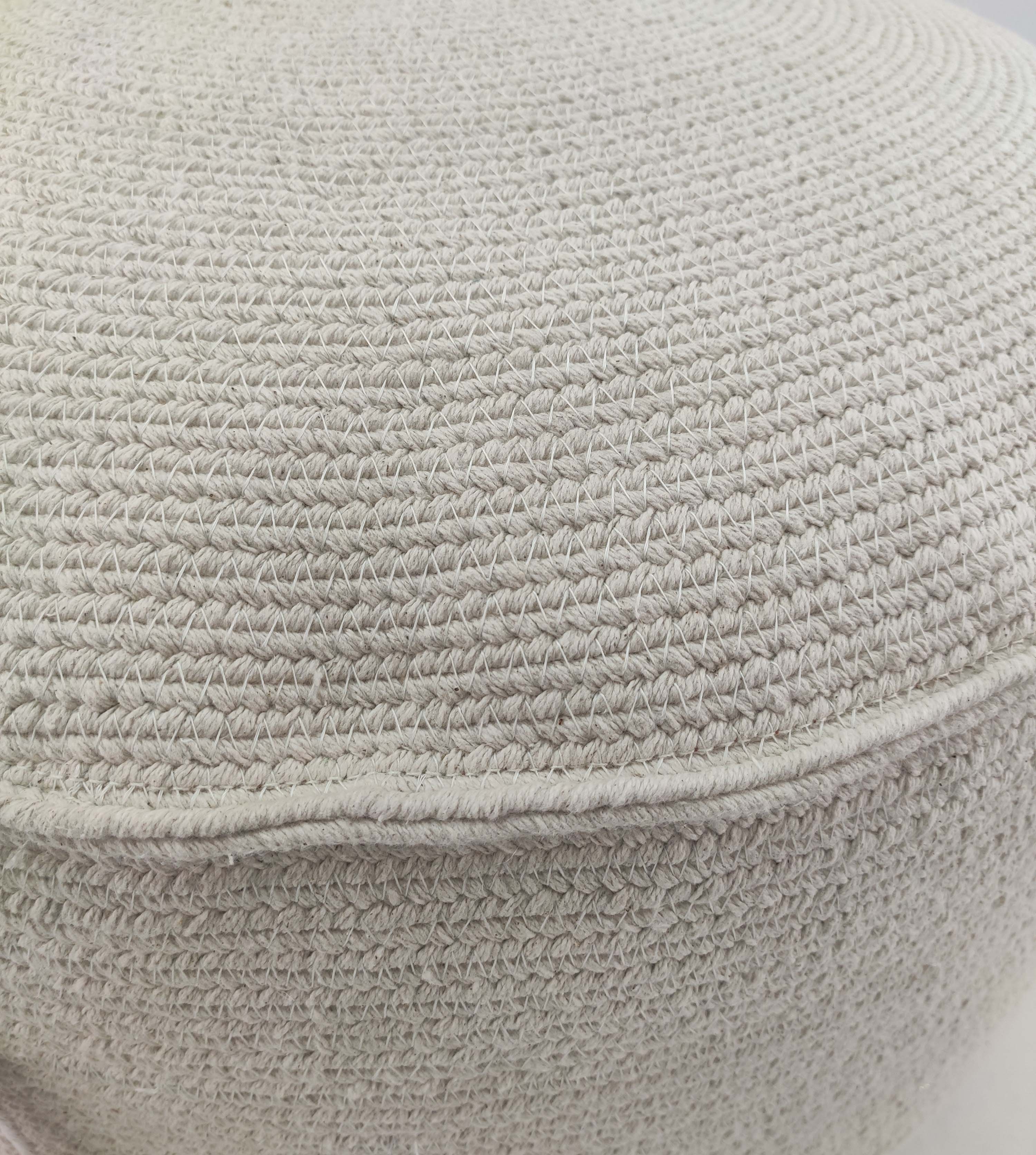 Close-up of the RAMSHA HOME White Cotton Pouf With Leather Handle PF-053, featuring detailed beige crochet stitching and a horizontal seam—an inviting accent to add textured charm to any living space.