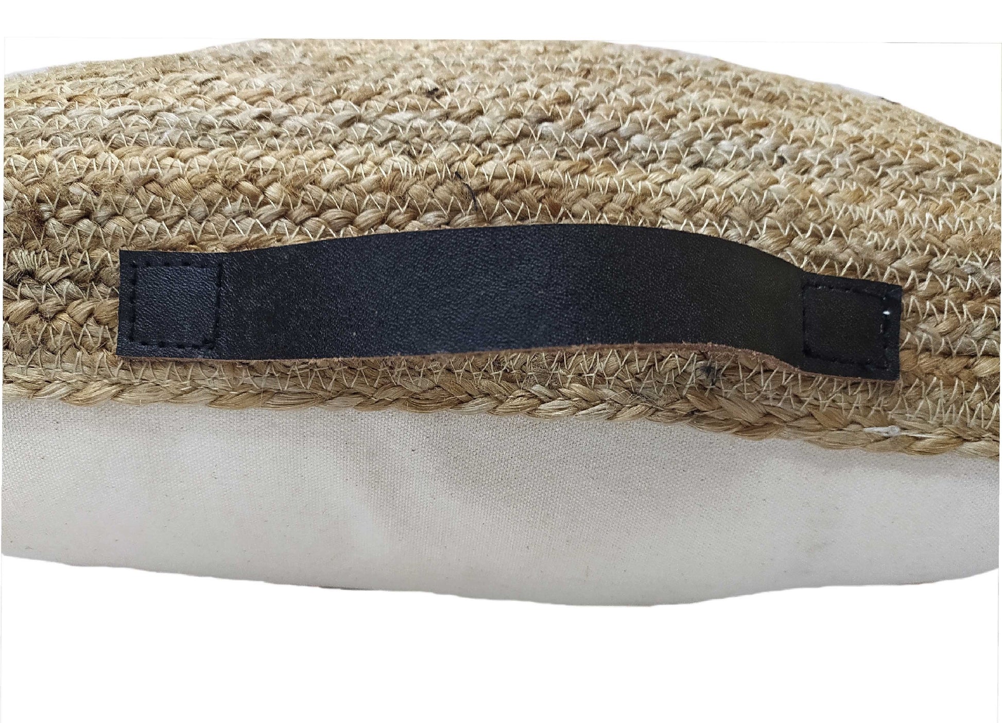 Close-up of a woven straw bag with a black leather handle and beige fabric bottom—perfect for modern décor and pairing with natural jute accents like the RAMSHA HOME Jute Cushion CS-134-T.