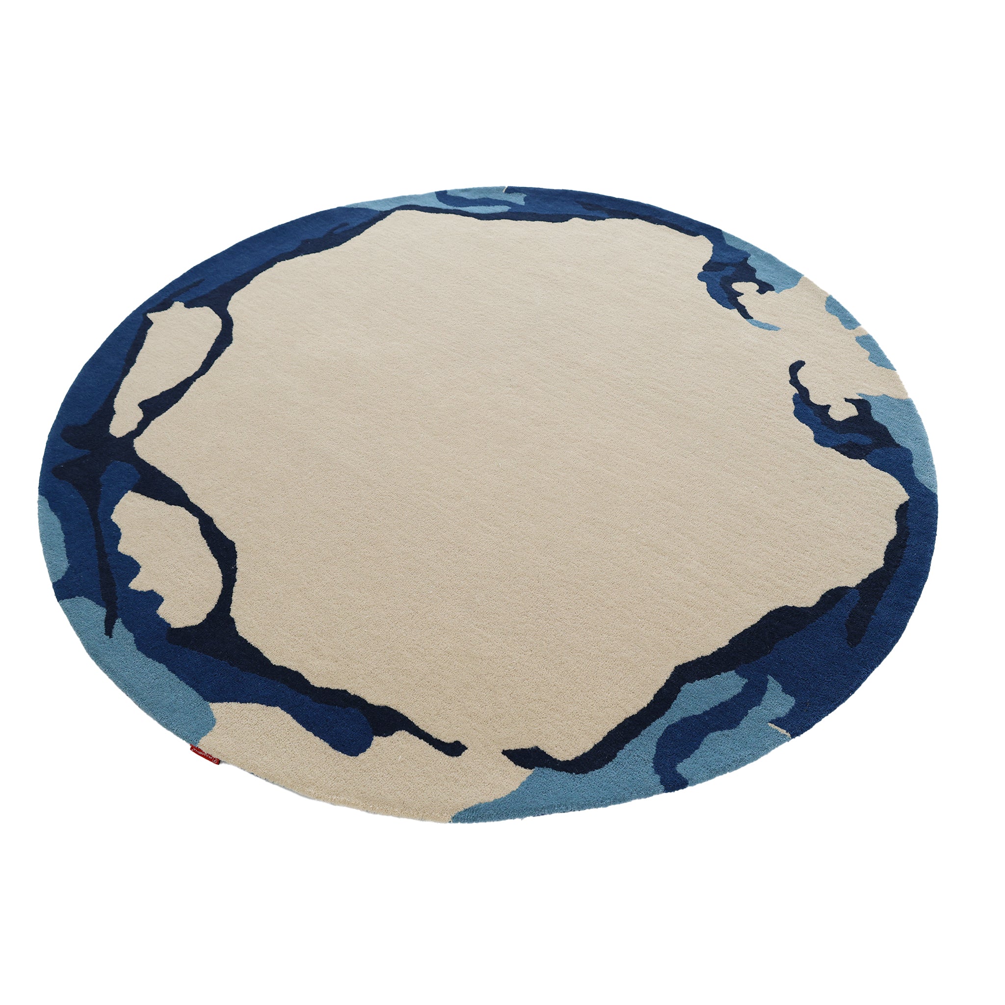 The RAMSHA HOME Round Handmade Hand Tufted Carpet HTW-64 features a beige center with abstract navy and blue edge patterns, creating a modern look reminiscent of a stylized map or landscape.