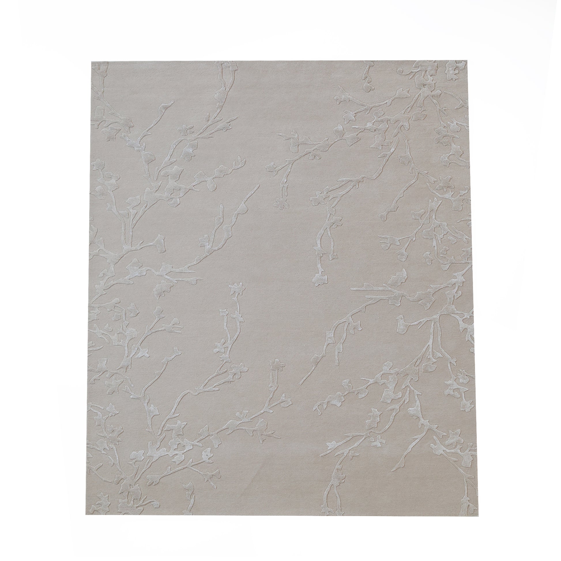 The Handmade beige Color Decor Rug- HTWV 115 by RAMSHA HOME features a subtle, textured branch pattern in a rectangular shape, shown isolated on a white background.