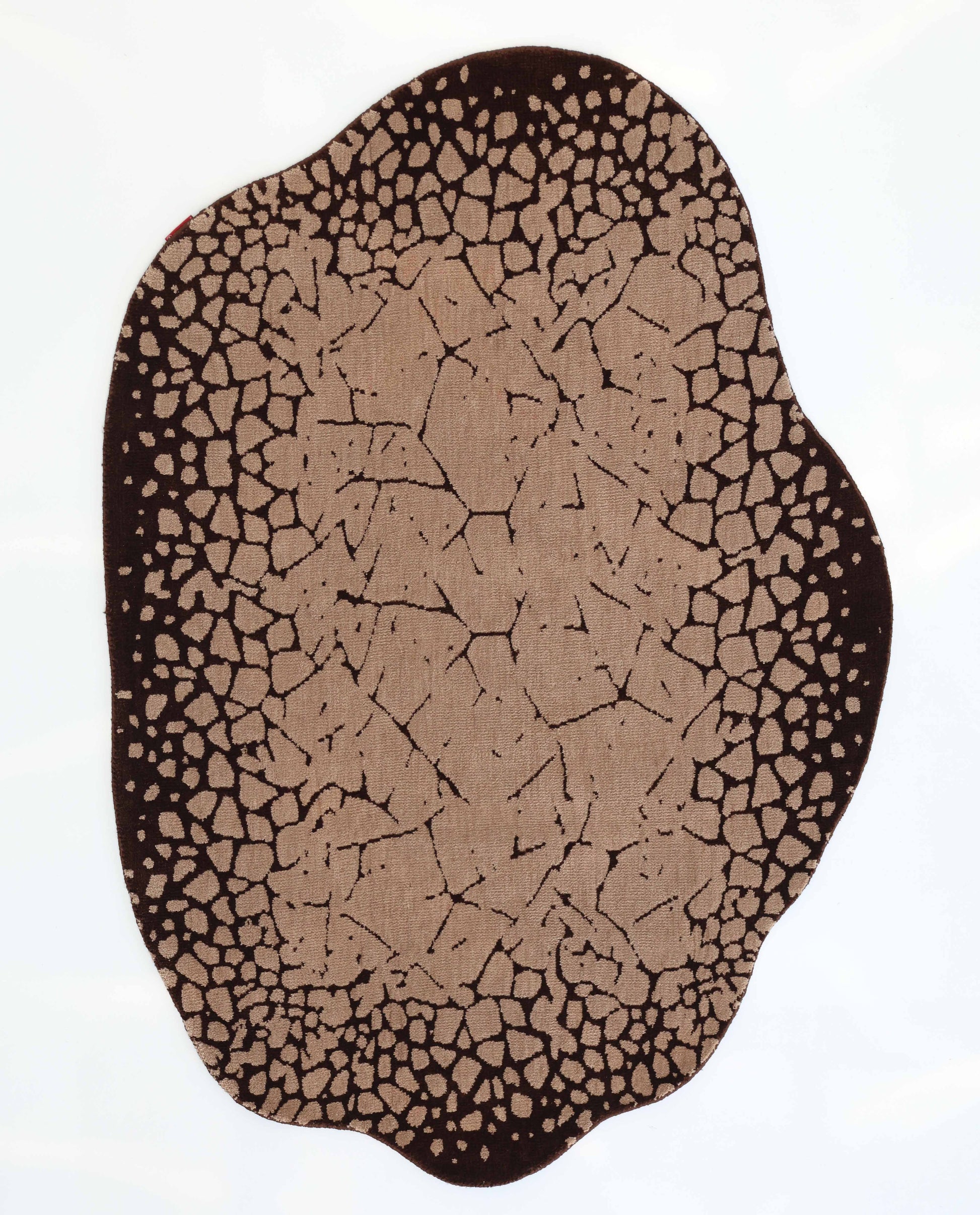 The RAMSHA HOME Terrain Echo Abstract Rug Shaped Rug CMN 118 features an irregular shape and earth-inspired pattern in brown and tan, with wavy edges, resembling cracked soil across a white background.