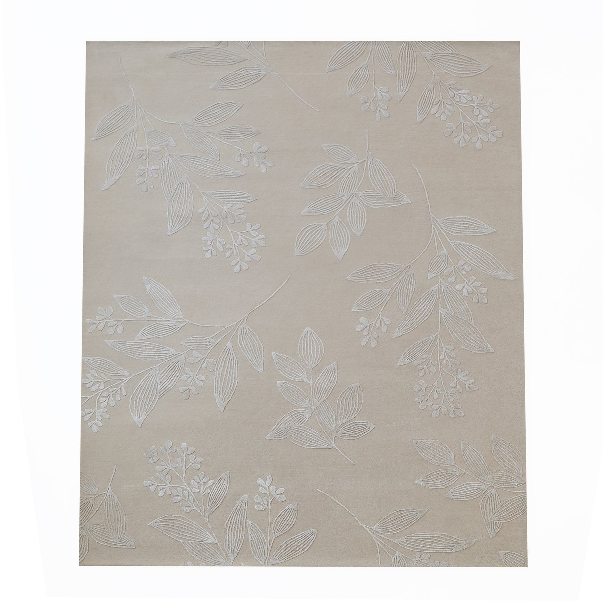 The RAMSHA HOME Natural Beige & Ivory Handmade Area Rug (HTWV-146) features a subtle white leaf and small flower cluster pattern scattered across its beige wool surface.