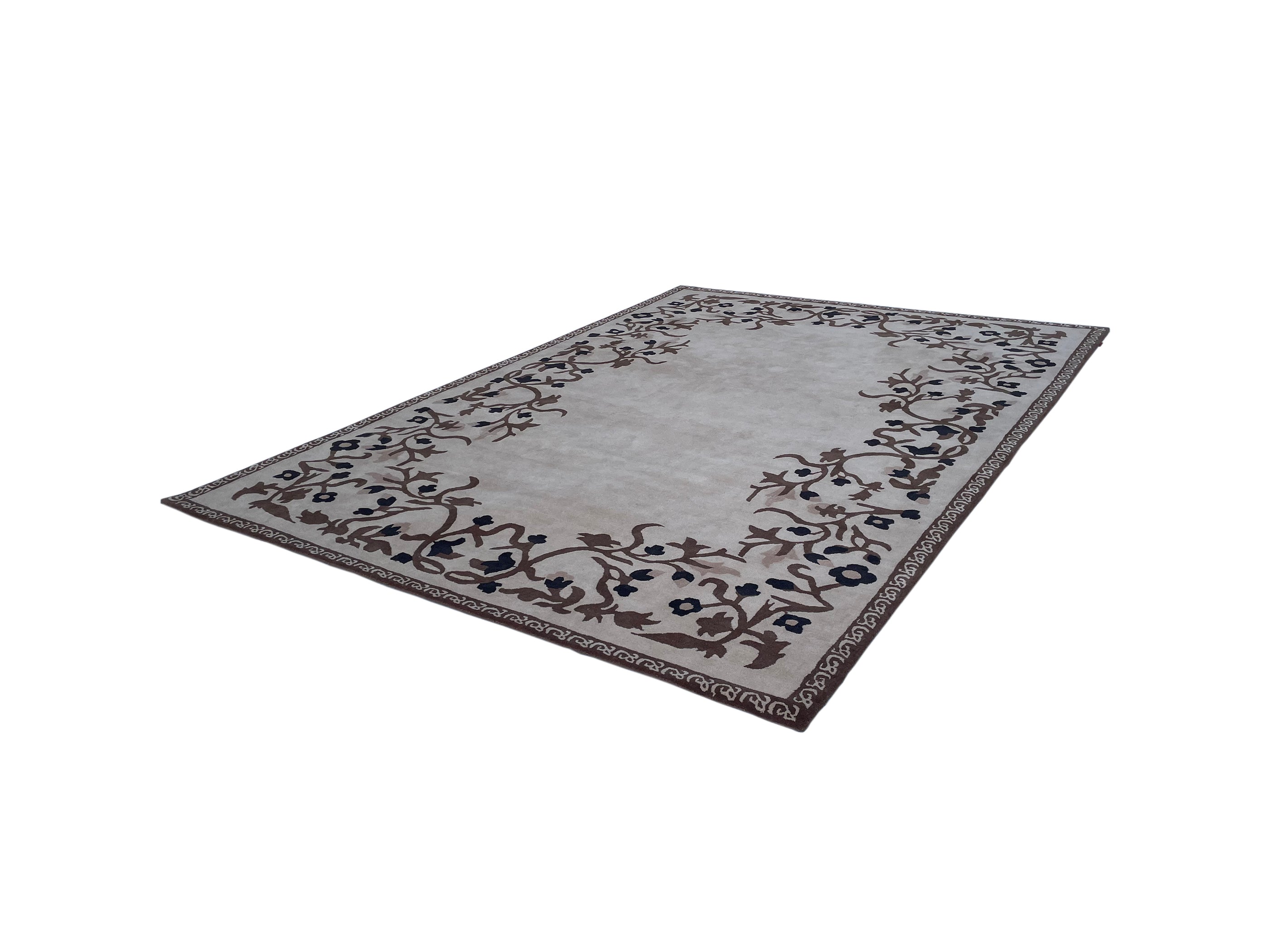 The RAMSHA HOME Traditional Home Decor Handmade Carpet – HTW-34 is a rectangular beige wool rug with a light center and brown and dark blue floral vine borders, hand-tufted and shown on a white background.