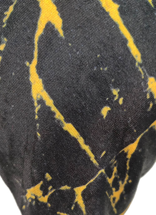 Close-up of RAMSHA HOME Polyester Cushion Cover, showcasing a durable black fabric with irregular yellow streaks and marble-like patches in an abstract pattern. Easy to clean and maintain.
