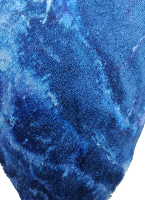 Close-up of RAMSHA HOME's Polyester Cushion Cover, featuring durable fabric in textured blue shades with subtle white patches, resembling a marbled or tie-dye design—easy to clean and stylish for any space.