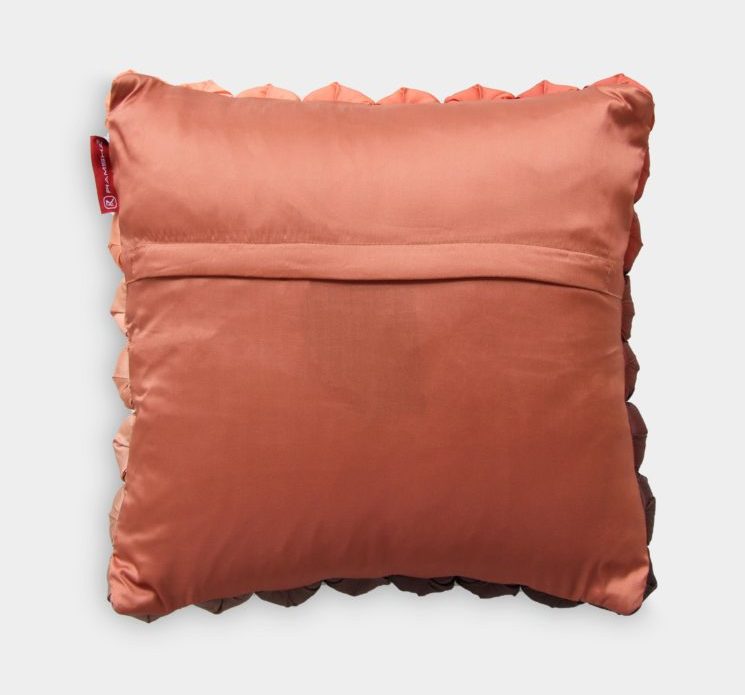 The RAMSHA HOME Polyester Bubble Cushion Cover is a shiny coral square pillowcase with a smooth finish, flap back, slight ruffles, and a small red tag on the top left edge.
