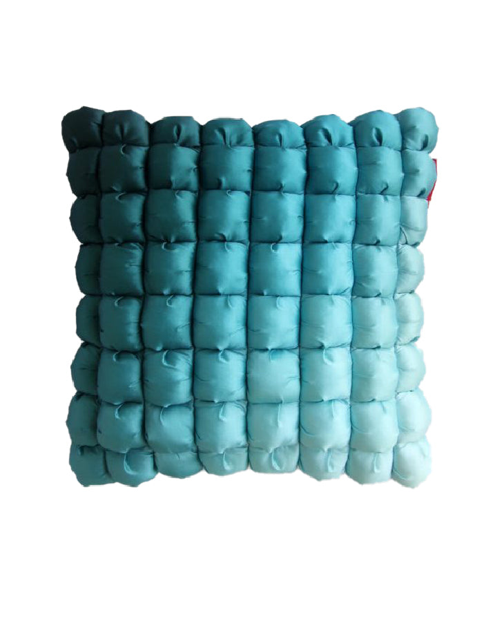 The RAMSHA HOME Polyester Bubble Cushion Cover features a square shape with a teal, tufted grid design of individually padded squares for a soft, bubble-like look against a white background.