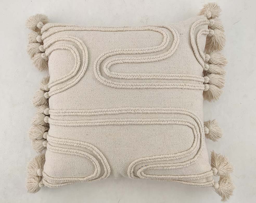 The RAMSHA HOME Cotton & Polyester Natural & White Color Cushion With Filler CS-009 features textured embroidered lines, tassels on the edges, and a soft blend fabric. Includes cushion and filler for comfort. Displayed against a light background.