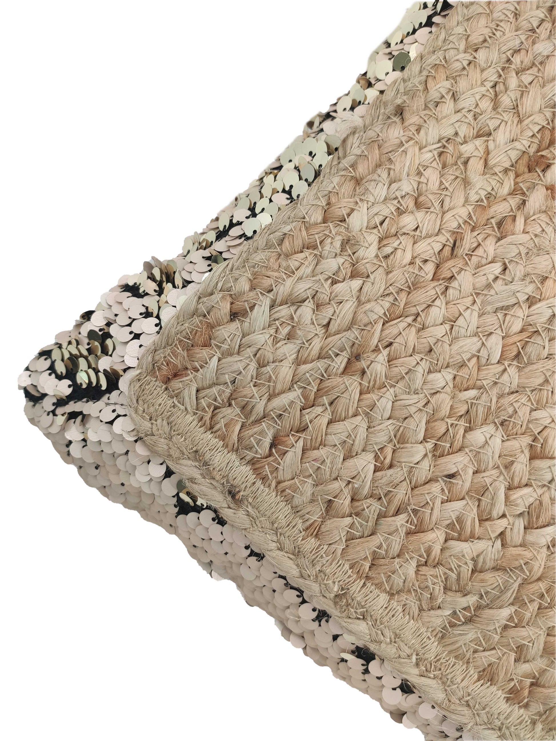 The RAMSHA HOME Jute Cushion With Filler Multi Color CS-015 features woven straw-like jute on one side and shiny, light sequins on the other, shown on a white background.
