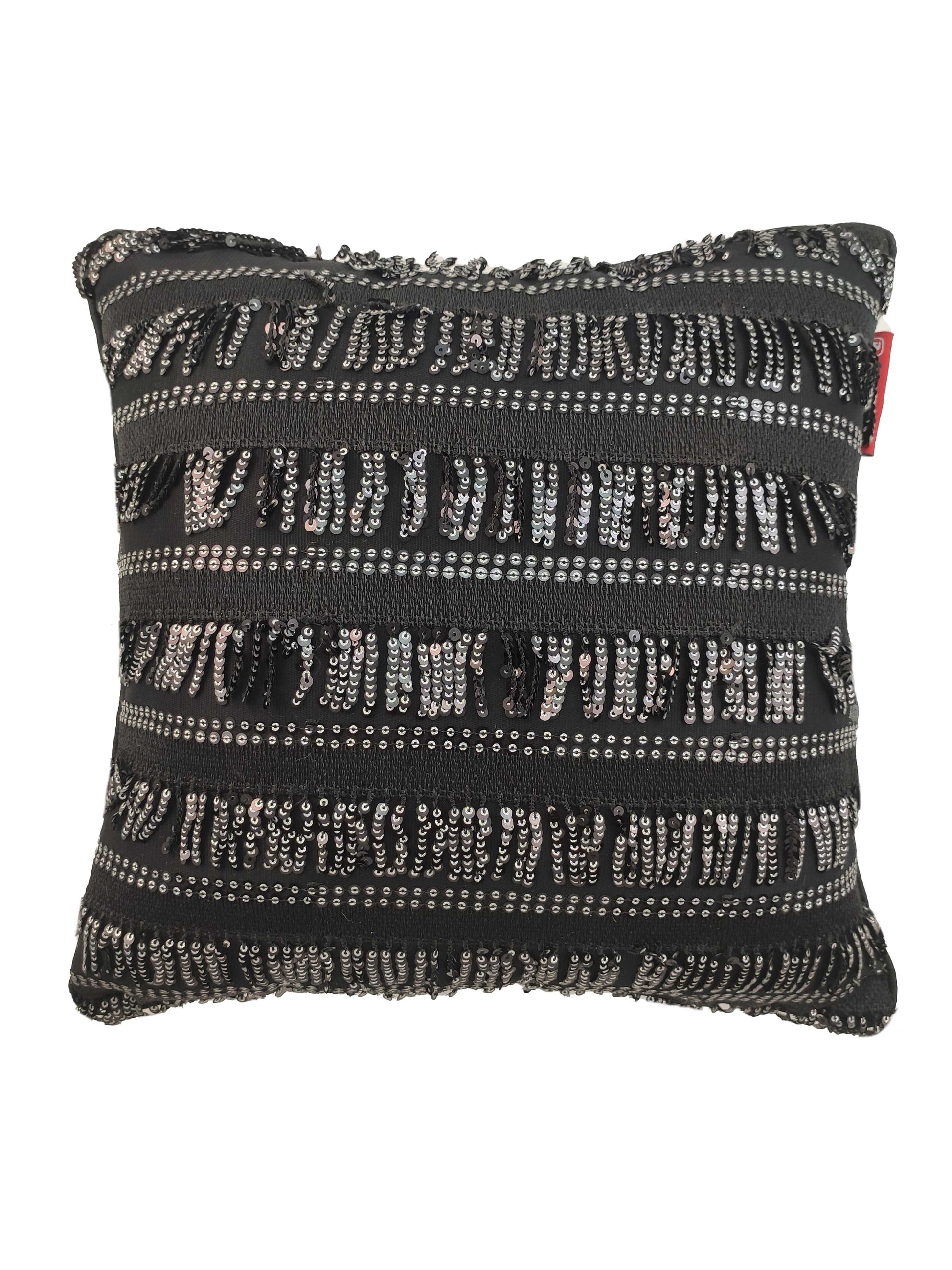 The RAMSHA HOME Modern Polyester Cushion Cover features a rectangular design with black fabric, accented by horizontal rows of silver sequins, black fringe, and textured stripes for a sparkling, modern look.