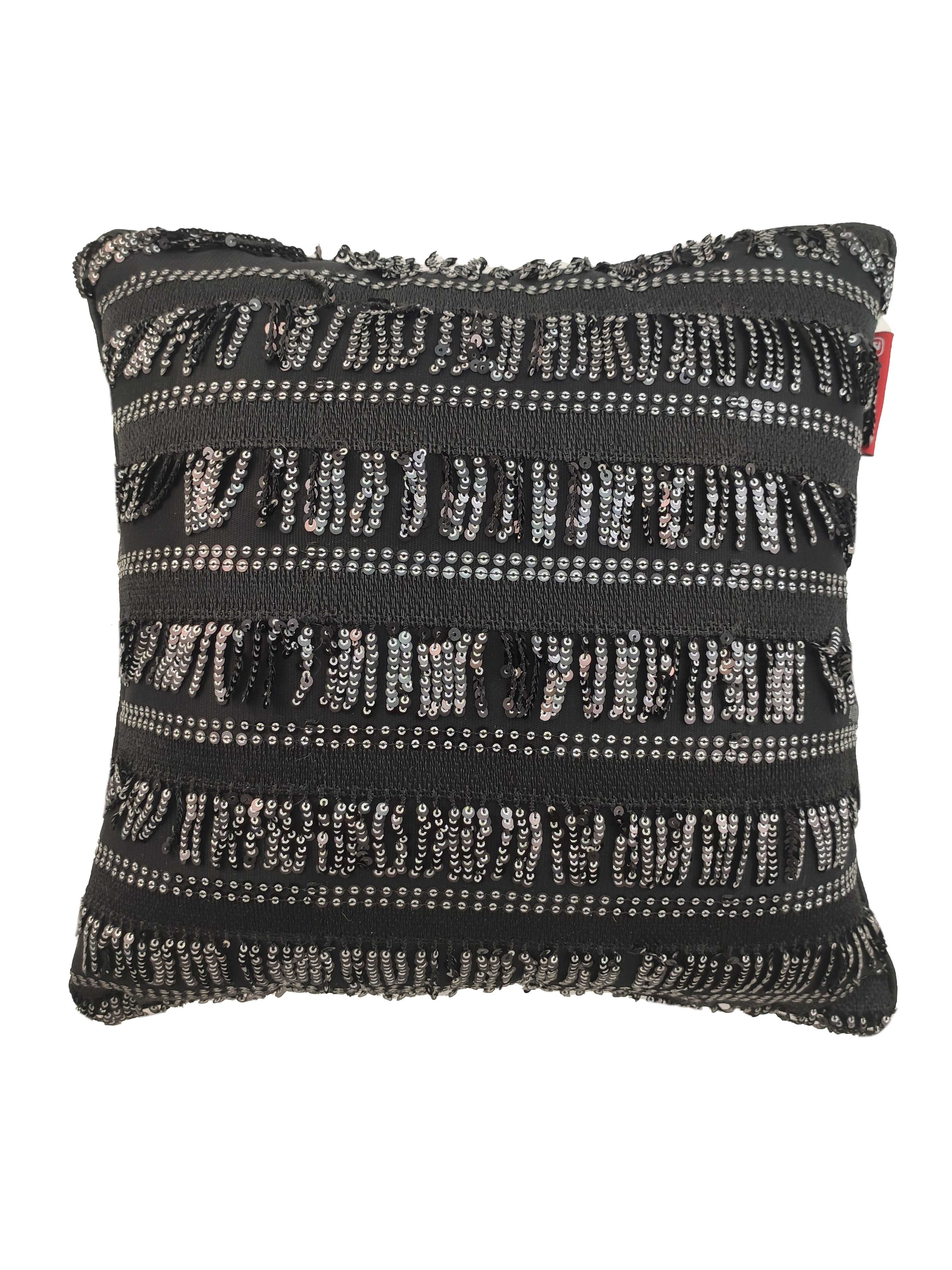 The RAMSHA HOME Modern Polyester Cushion Cover features a rectangular design with black fabric, accented by horizontal rows of silver sequins, black fringe, and textured stripes for a sparkling, modern look.