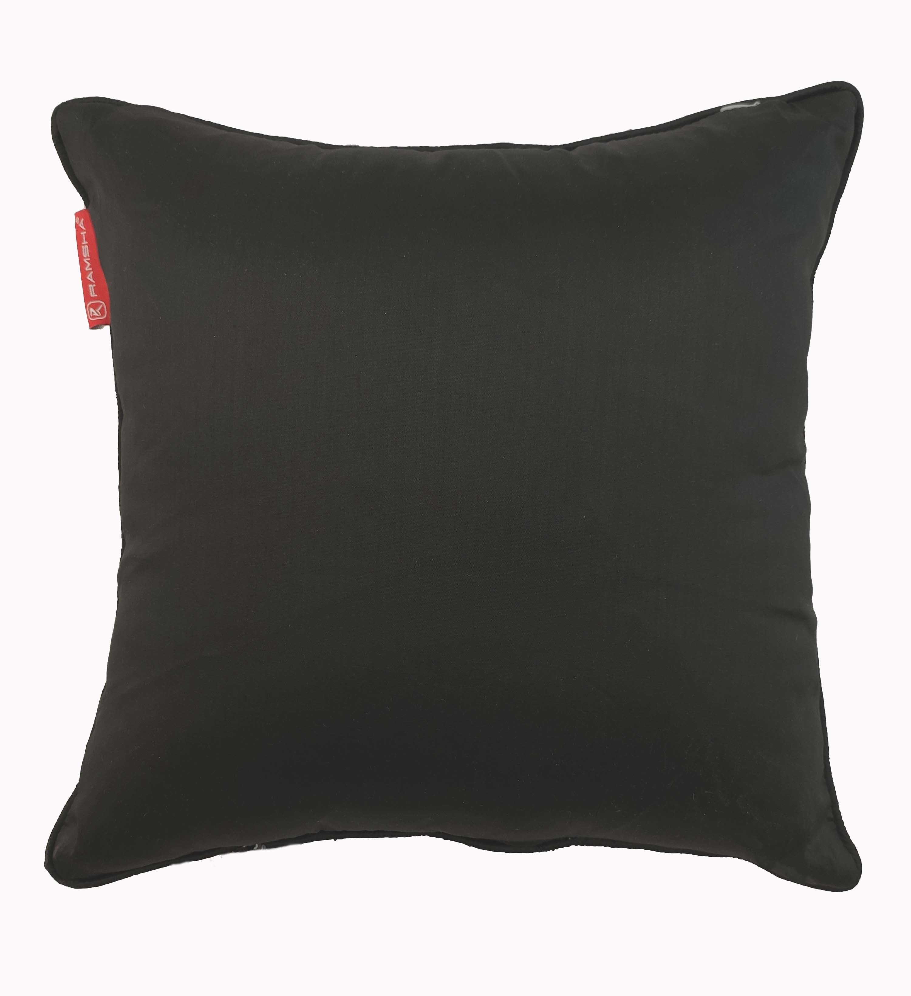 The RAMSHA HOME Modern Polyester Cushion Cover is a plain black square pillow with a slightly shiny finish and a small red tag on the side, shown against a white background.
