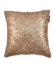 The RAMSHA HOME Polyester Sequine Cushion Cover features shiny gold sequins and a textured, reflective surface. A small red tag adds detail, making it a bold accent for your living room. Displayed against a white background.