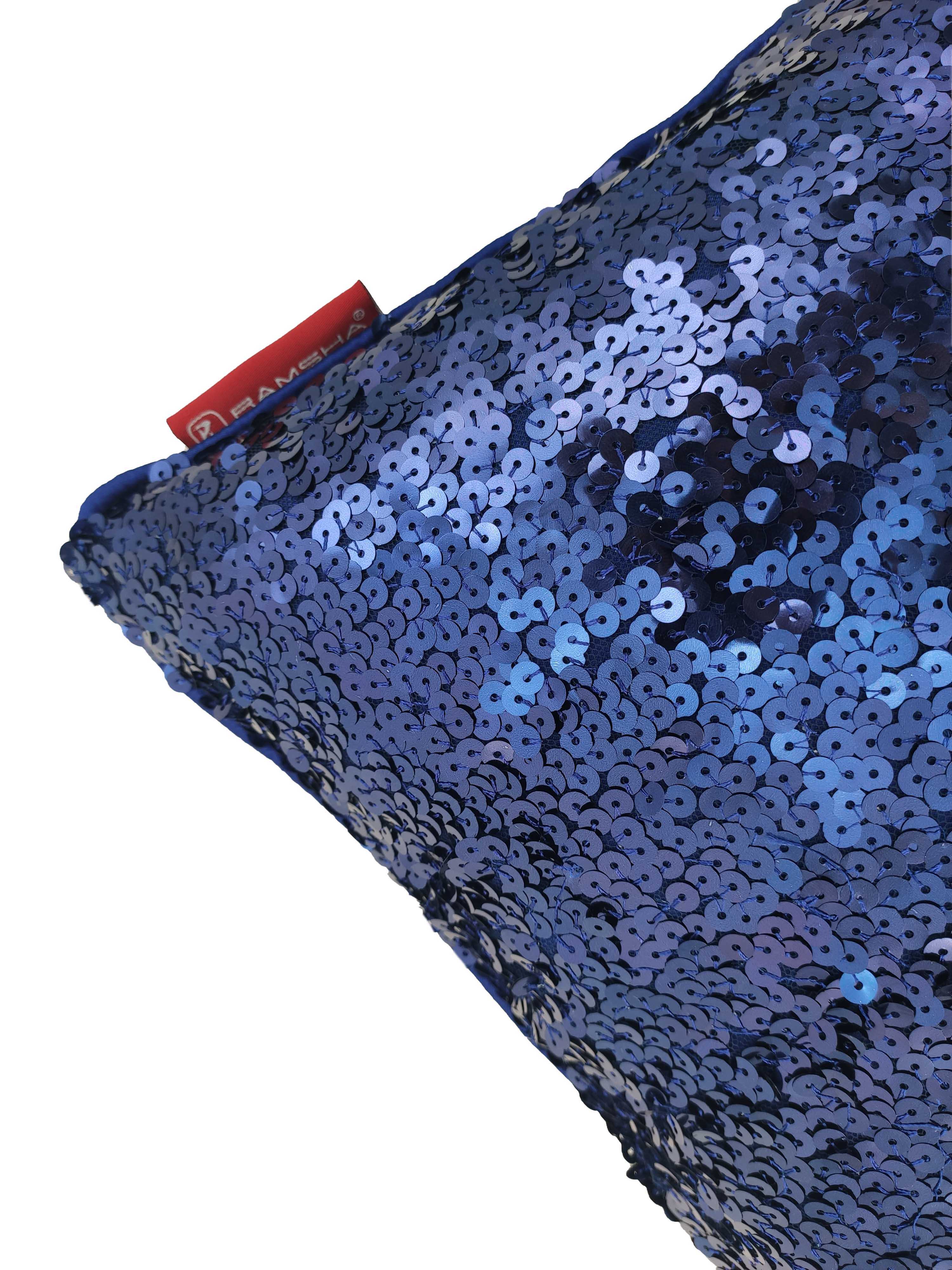 Close-up of RAMSHA HOME Polyester Sequine Cushion Cover in shiny blue, featuring a red tag at the top left corner—perfect for adding sparkle to your home decor against a white background.
