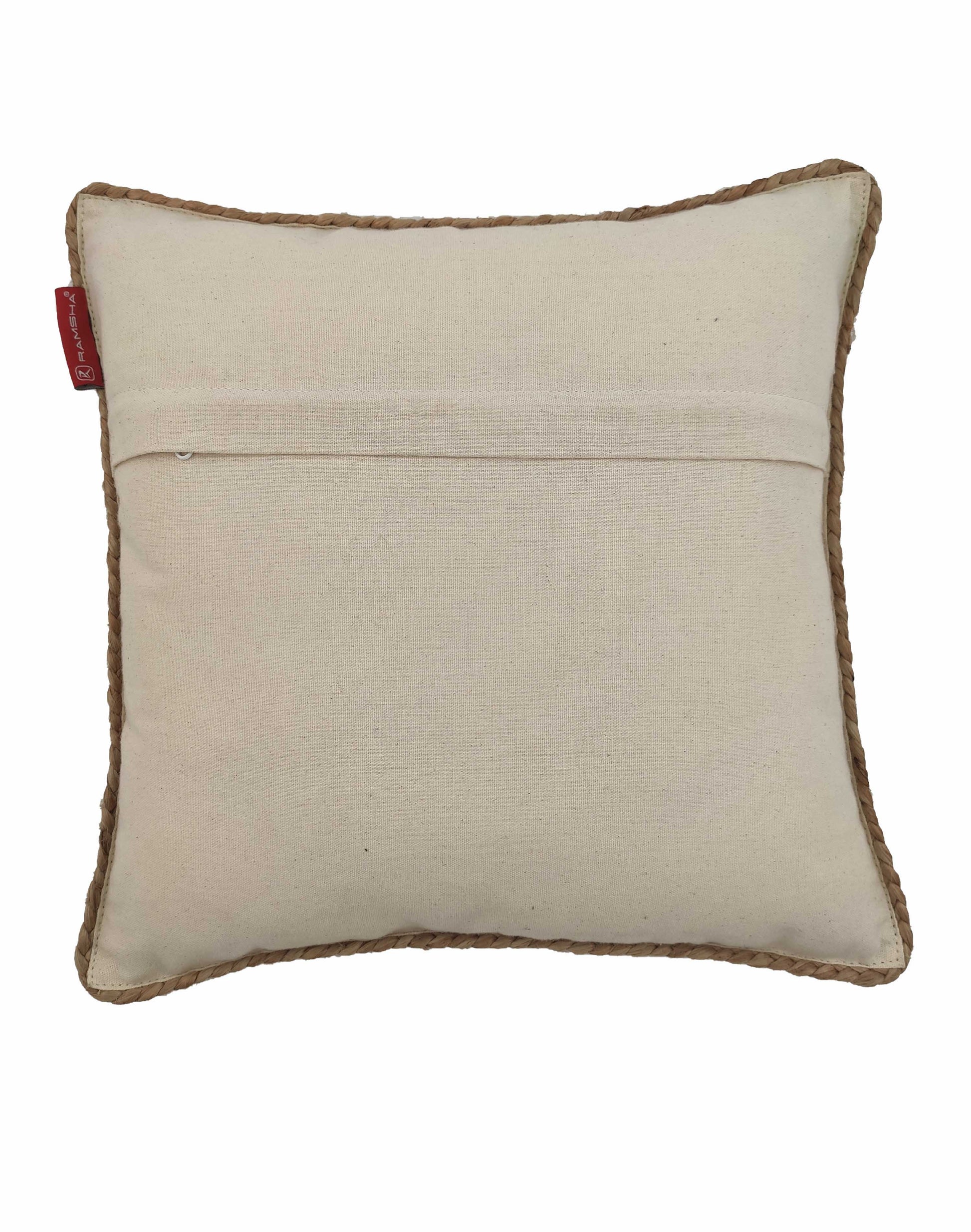 The RAMSHA HOME Jute Cushion With Filler CS-032 is a square beige cushion with brown trim, horizontal stitched seam on the back, and a small red tag on the left edge. Made from natural jute fabric.
