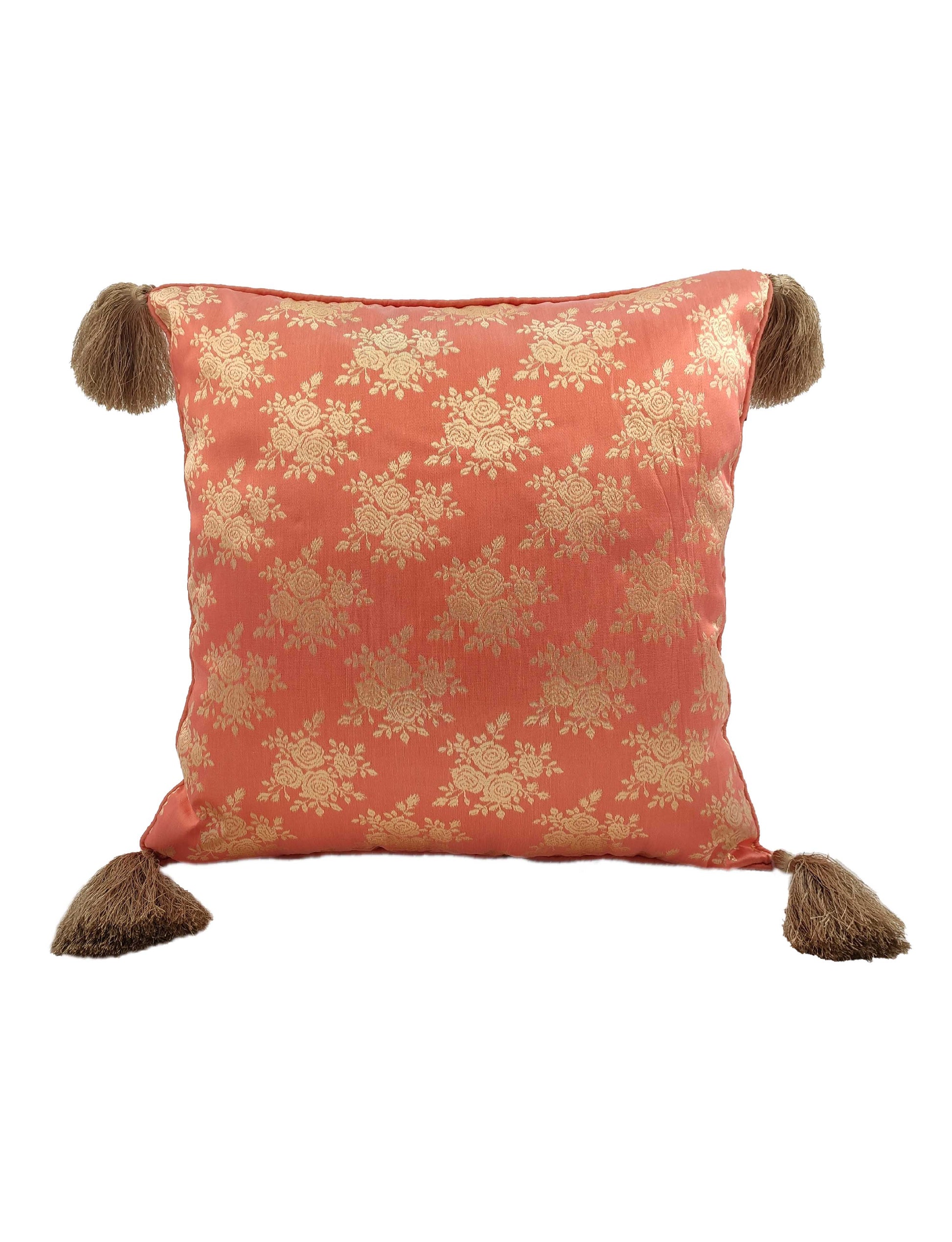 The RAMSHA HOME Light Pink Cushion Cover CS-043 features a coral pink and gold floral pattern with large brown tassels on each corner, adding an elegant, stylish accent to your décor and brightening spaces against a white background.