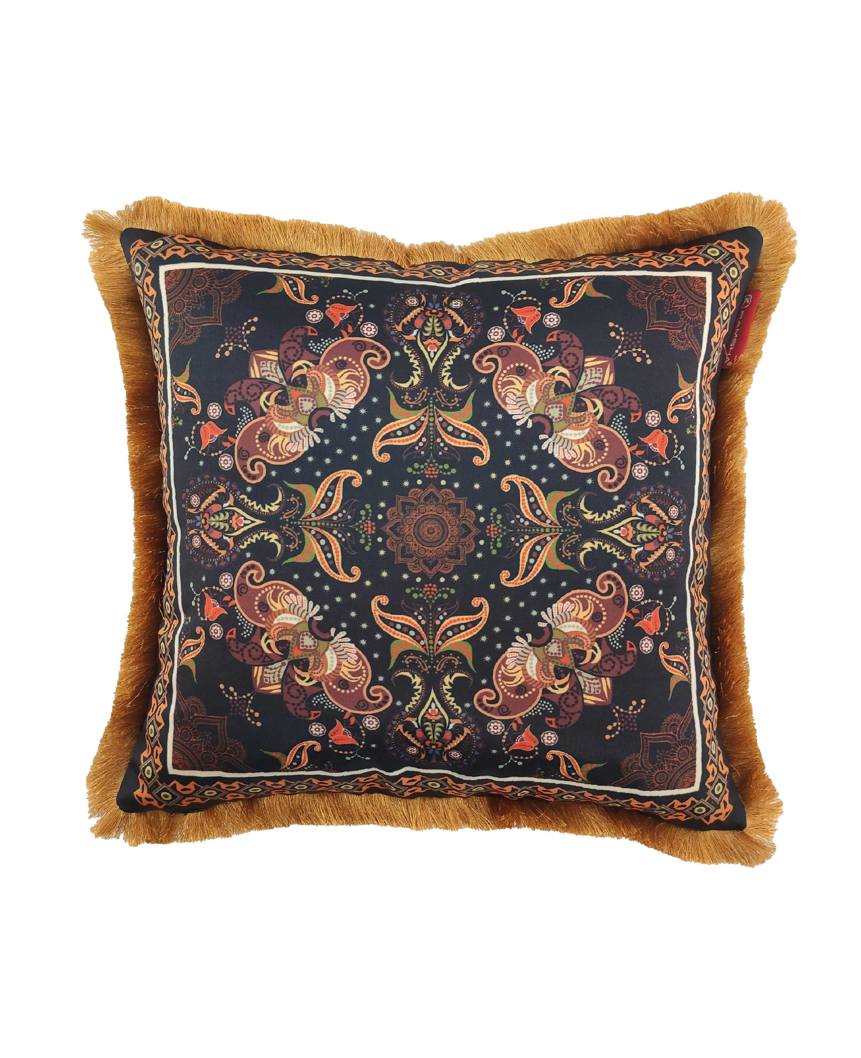 The RAMSHA HOME Multi Color Printed Cushion With Filler CS-052 features a square shape, vibrant paisley and floral patterns on a dark background, gold fringes, and adds a bohemian or vintage flair to your decor.