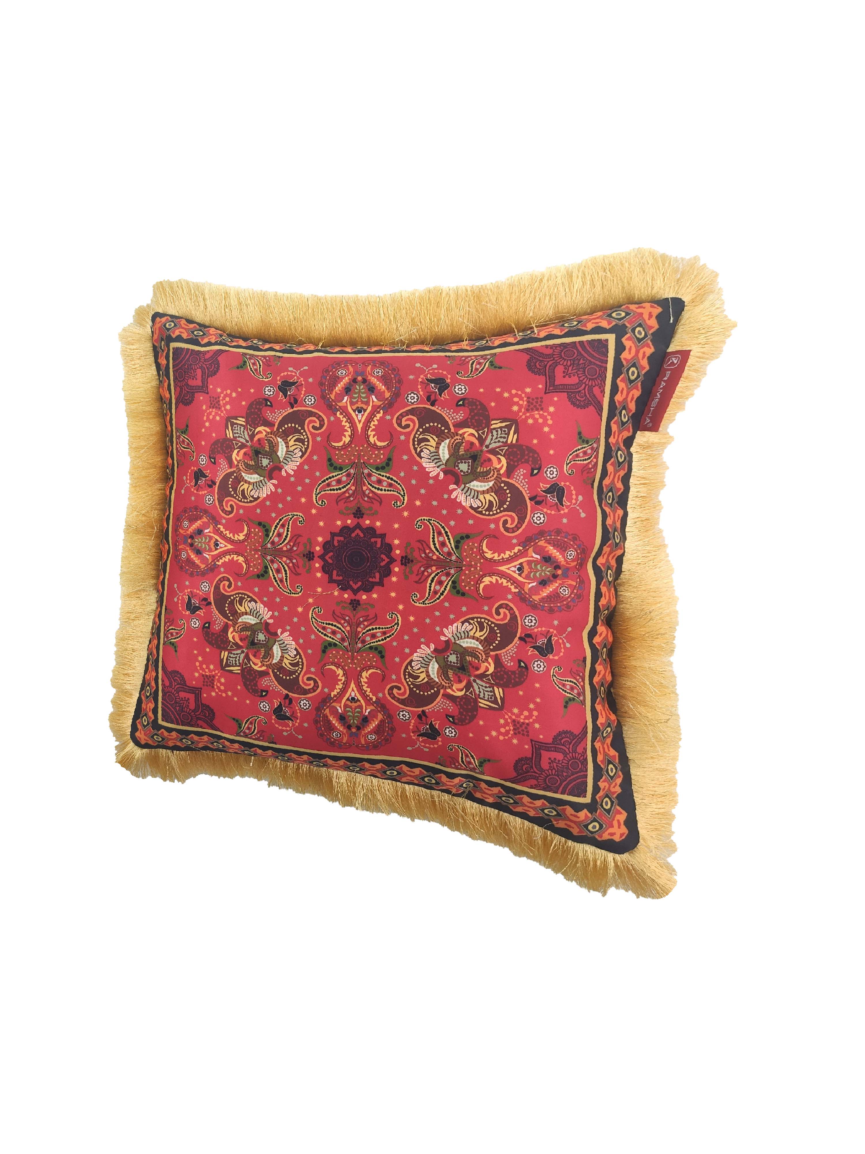 The RAMSHA HOME Decorative Cushion With Filler CS-060 is a square cushion with plush filling, featuring a red paisley and floral pattern, black border, golden fringes, and crafted from high quality fabric against a white background.
