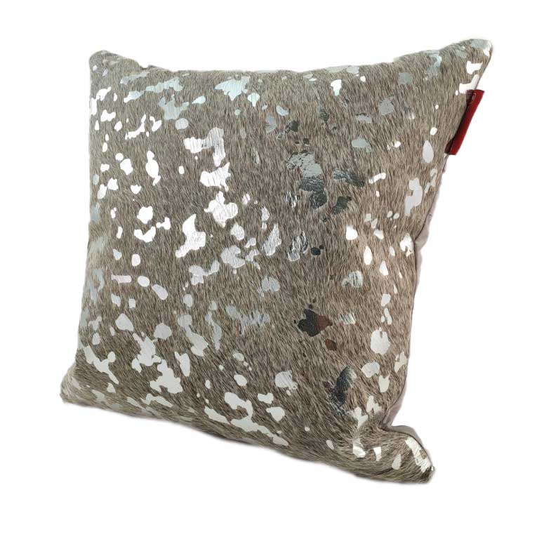The RAMSHA HOME Decor Leather Cushion With Filler CS-092 features a beige faux fur texture with silver spots for a shimmering look, plus a small red tag on one corner that adds a unique touch to this luxury accent pillow.