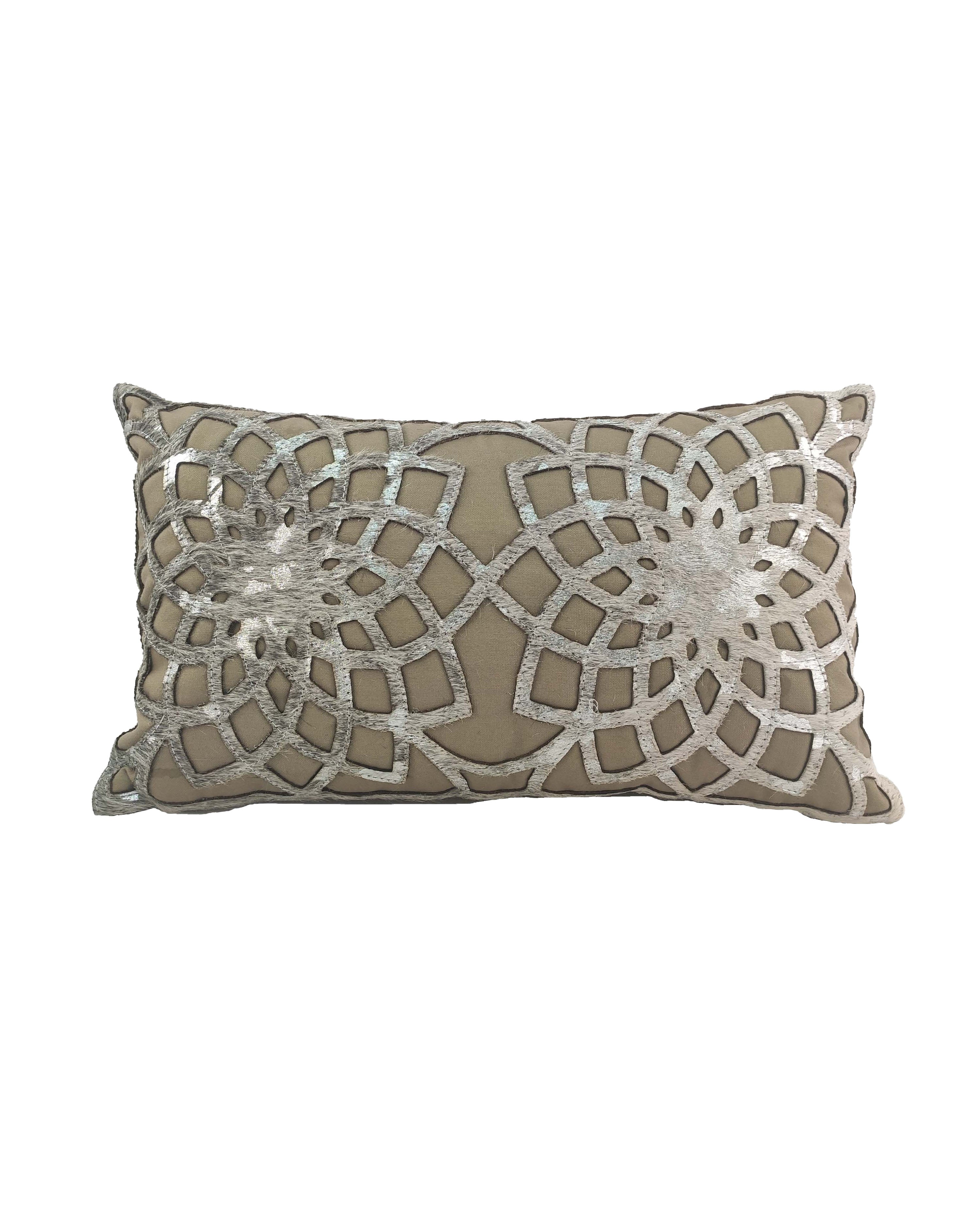 The CS-102 Leather Cushion by RAMSHA HOME features a luxurious rectangular design in beige with intricate silver geometric floral patterns and metallic accents on the front.
