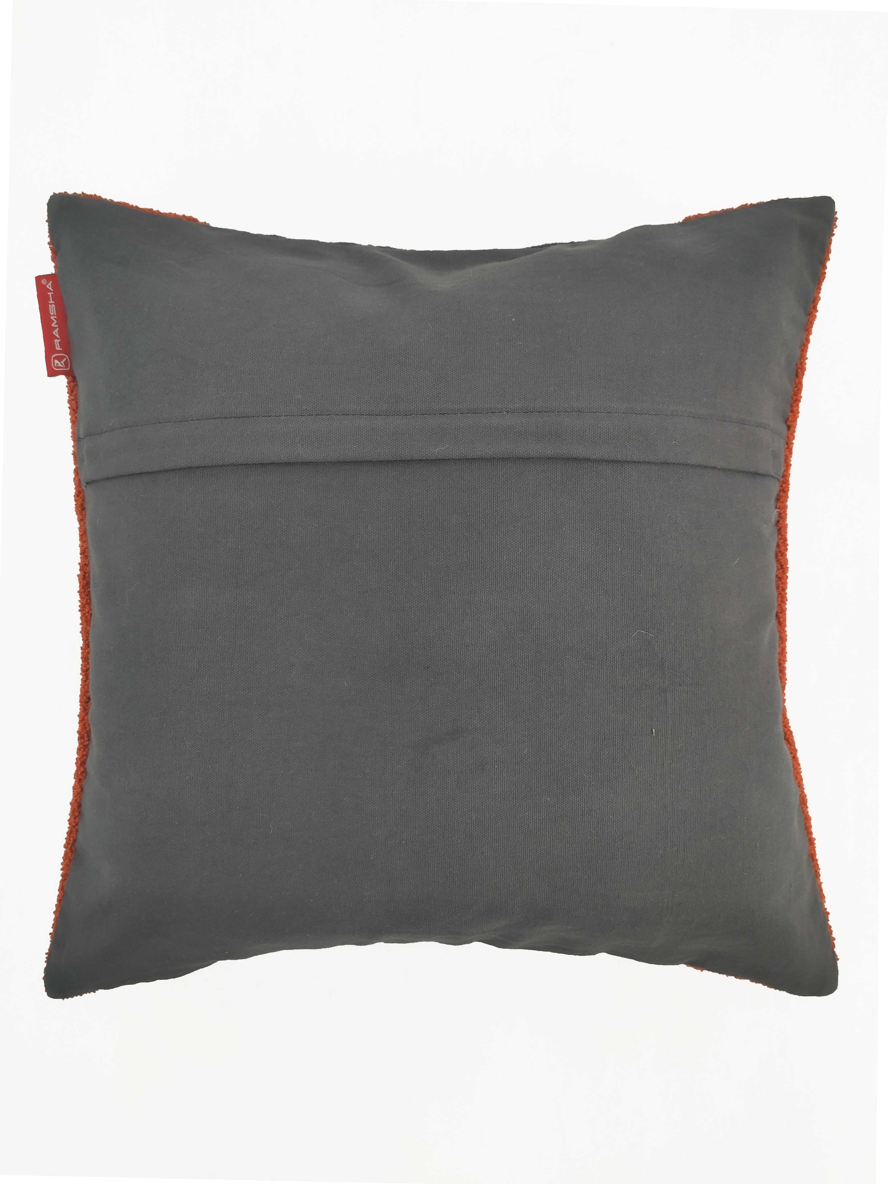 The RAMSHA HOME Rust Color Cushion CS-121 is a square cushion with cotton-polyester fabric, visible seam, and a red tag on the left side—an ideal accent to elevate your home décor.