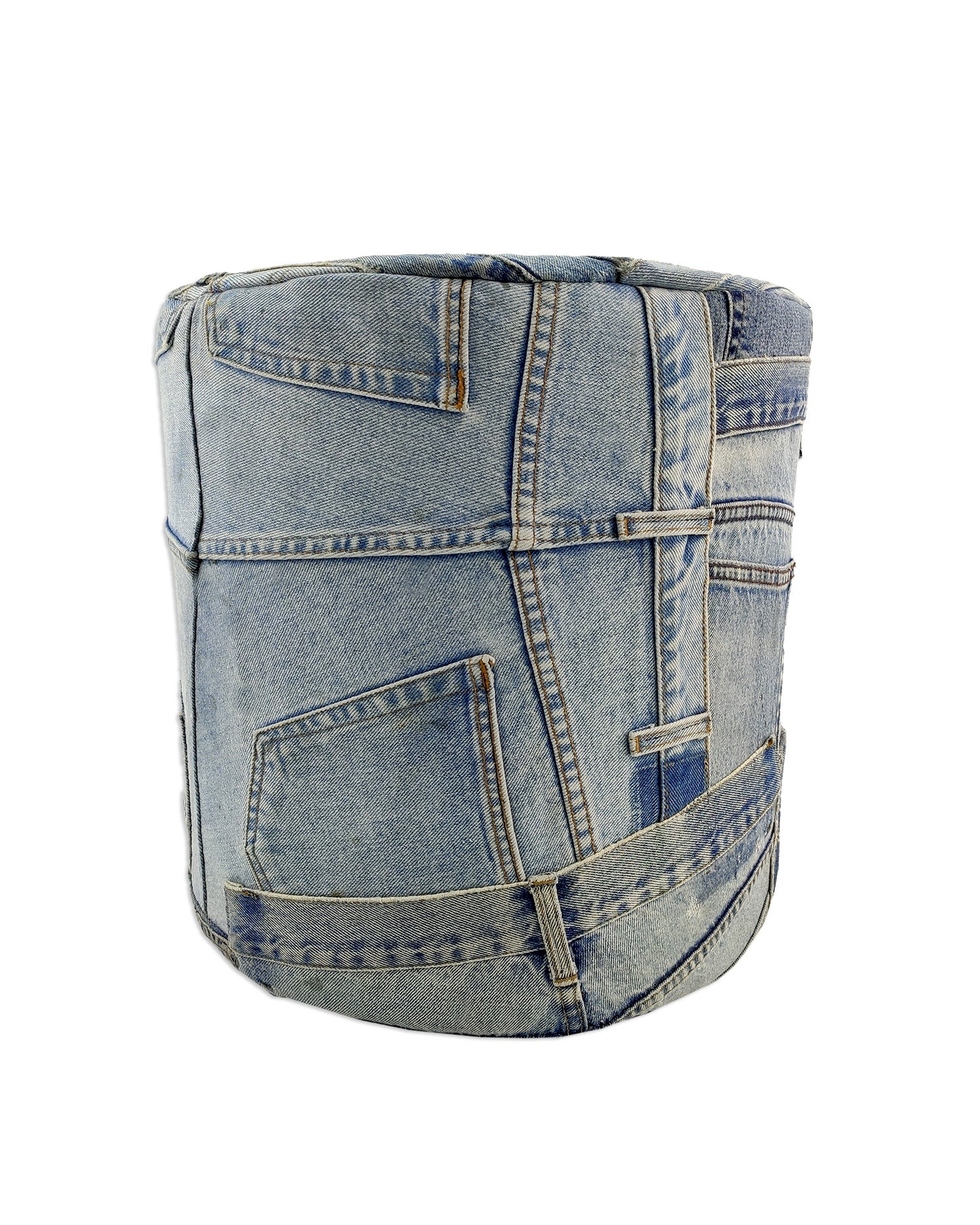 The RAMSHA HOME Denim Cylindrical Cotton Pouf PF-083 features visible seams, pockets, and belt loops from repurposed blue denim—ideal as an ottoman or extra seating for any casual space.