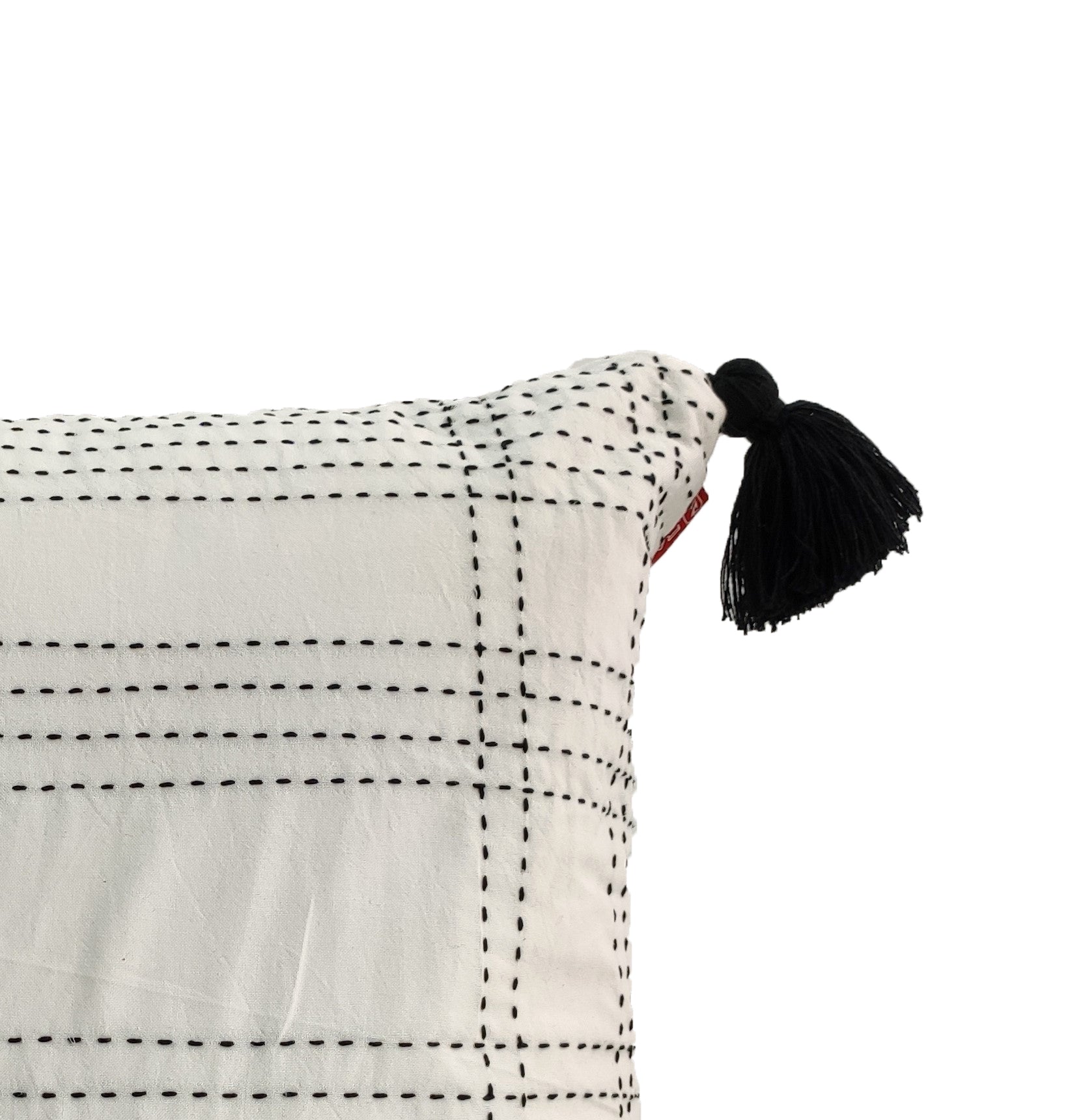Close-up of the RAMSHA HOME Embroidery White And Black Cotton Cushion With Tassel CS-193, showcasing stitched grid lines and a black tassel on the corner, set against a plain white background.