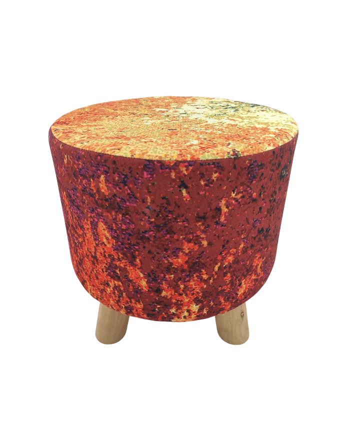 The RAMSHA HOME Polyester Stool Pouf features a small, round design with a vibrant orange, red, and yellow speckled polyester cover and sturdy short light wood legs.