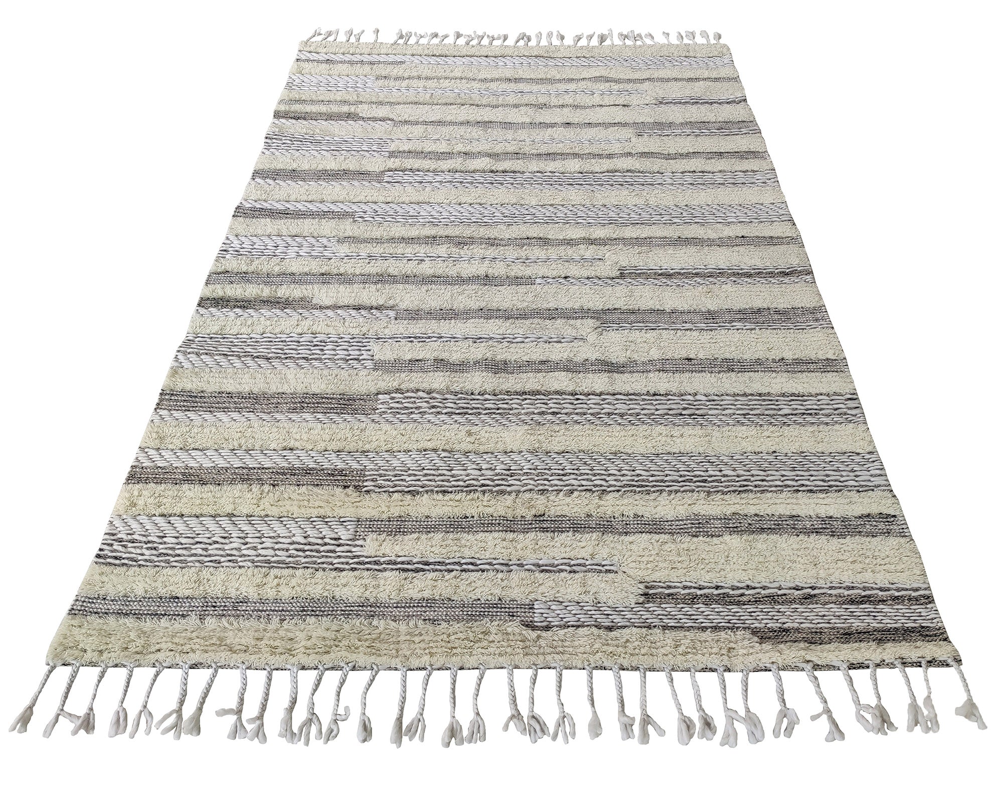 The RAMSHA HOME Fringes Woven Rug (SR-053) is a rectangular grey and ivory wool blend rug with a striped textured pattern and fringed edges, perfect for living rooms or bedrooms. Seen from an angled perspective.