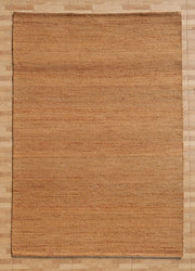 A rectangular Handmade Natural Color Hand Woven Area Rug SR-064 by RAMSHA HOME, with its natural brown jute fibers and subtle linear texture, lies on a light wood floor. This artisanal area rug features handmade craftsmanship and gentle color variations, bringing a simple and earthy elegance that enriches any home décor.