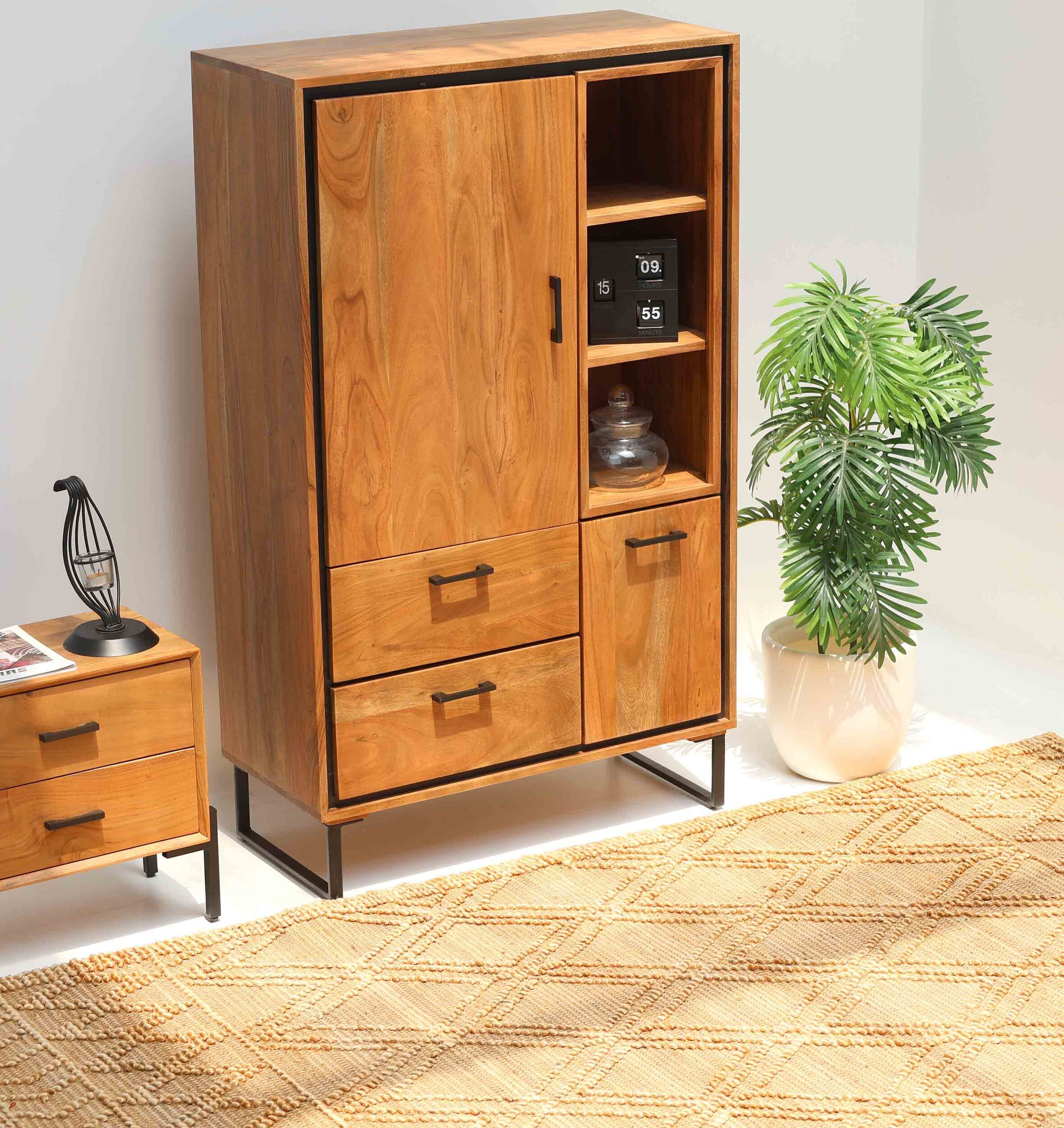 The Handcrafted Acacia Wood Cabinet Almirah with open shelves by RAMSHA HOME, featuring black metal legs, stands beside a matching nightstand, a potted plant, and a beige patterned rug in this bright living room.