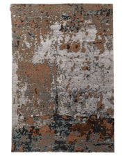 Introducing the Bamboo Silk & Cotton Hand Knotted Carpet HKWB-012 from RAMSHA HOME—a rectangular area rug showcasing an abstract pattern in muted shades of gray, brown, blue, and touches of black. Inspired by the weathered elegance of a grey rust rug, its hand knotted design displays irregular shapes and color patches with subtle variations, creating a beautiful distressed appearance that brings together contemporary style and timeless sophistication.