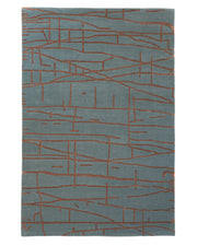 The Abstract Rust Line Grid Teal Rug – HTWV-31 (180x270 CM) by RAMSHA HOME is a rectangular gray wool viscose rug, hand tufted with an abstract pattern of intersecting thin brown lines in a modern, geometric design that brings contemporary elegance to any space.