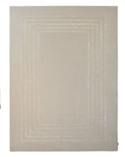 The RAMSHA HOME Hand-Tufted Carpet For Home And Office HTWV-70 is a contemporary rectangular beige rug, featuring subtle concentric rectangular border patterns in light beige that create a layered effect. Crafted from wool, this minimalist floor covering adds a sophisticated touch to any interior while ensuring both style and comfort.