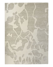 The RAMSHA HOME Multi Color Handmade Area Rug - HTWV-132 is a rectangular handtufted rug featuring an abstract pattern of irregular beige and light gray shapes, expertly crafted from a luxurious wool viscose blend for a modern and organic look.