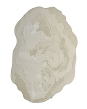 The Stylish Handmade Shape Rug Multi Color HTWV-105 by RAMSHA HOME features abstract, irregular shapes in beige and off-white with layered, wavy patterns reminiscent of natural stone or clouds. Hand tufted from wool, this cream-toned rug offers a neutral textured style perfect for modern interiors.