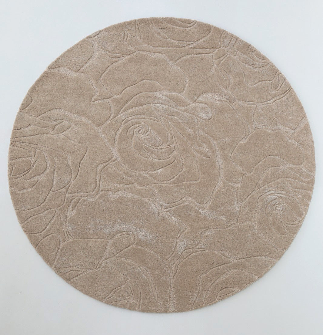 The RAMSHA HOME Home Decor Handmade Area Rug - HTWV-156 is a round beige wool rug, hand tufted with a carved texture of large overlapping roses, shown on a plain white background.