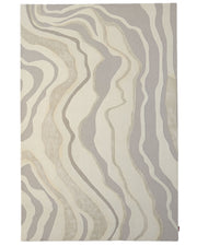Introducing the RAMSHA HOME Handcrafted Living Room Area Rug – HTWV-127: This modern rectangular area rug features wavy, organic lines in soothing shades of beige, cream, and light gray, creating a softly layered abstract pattern. Handtufted for lasting durability and style, it is a sophisticated neutral piece—ideal for contemporary living spaces.