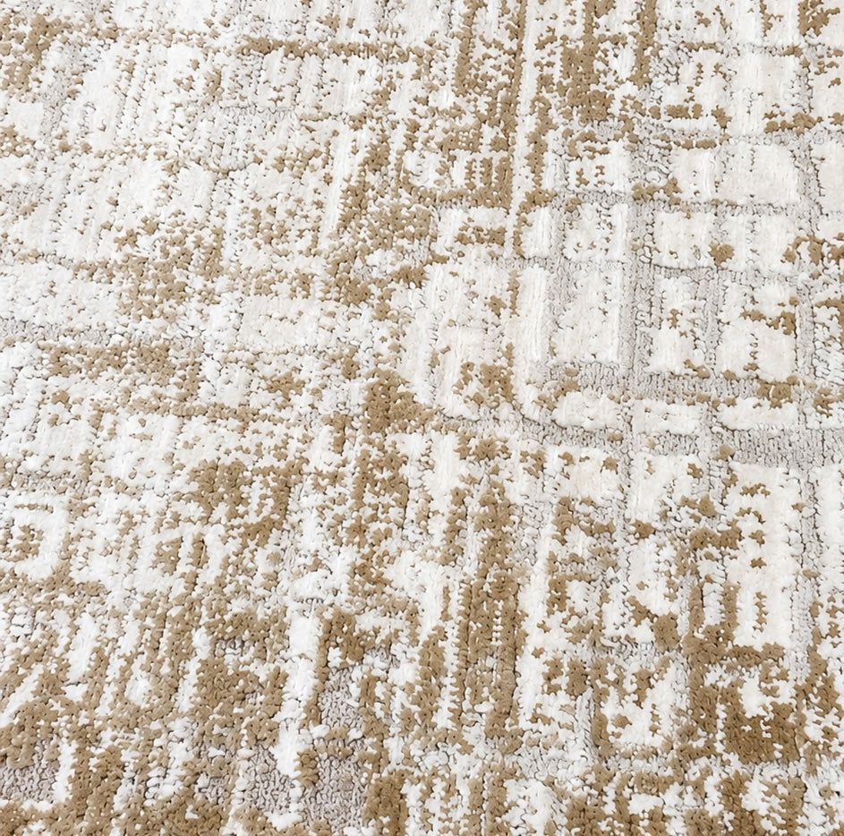 Close-up of the RAMSHA HOME Machine Made Turkish Area Rug - MR483 FLORENCE, featuring a beige and white abstract geometric pattern with textured soft fibers and a mix of raised and flat areas.