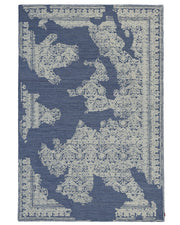 Introducing the Blue Mosaic Handcrafted Luxury Area Rug- HTW 145 by RAMSHA HOME—a blue rectangular rug detailed with an ornate cream pattern reminiscent of a gracefully faded vintage design, and framed by intricate decorative motifs. This vintage-inspired rug adds timeless charm and character to any space.